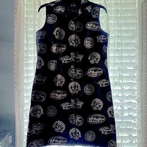 Harley Davidson button up front dress with parts and logo all over it. Size med